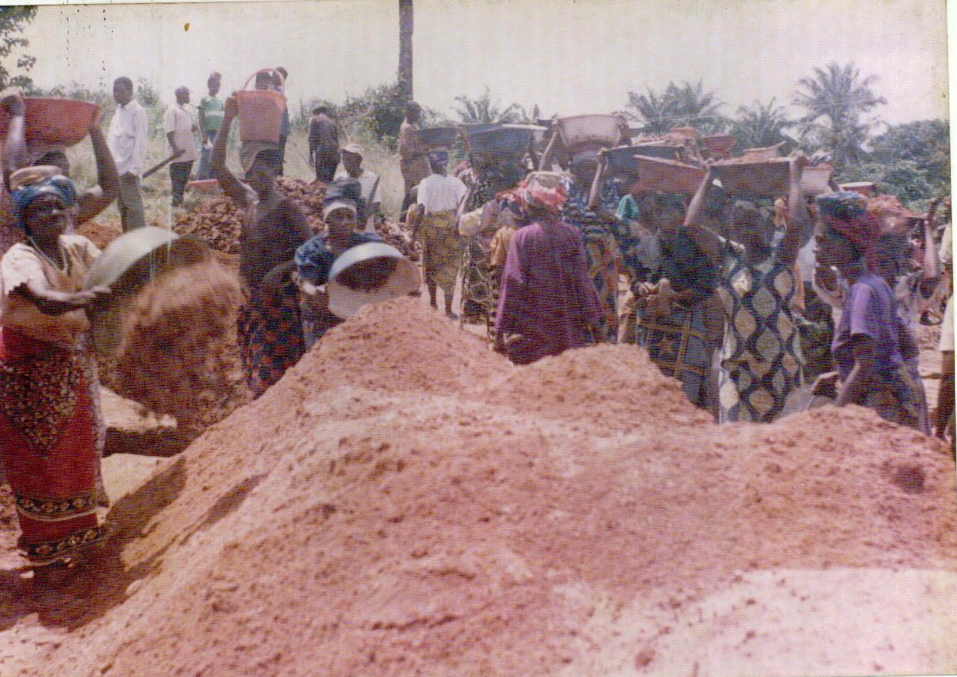 Community fetching water before the project